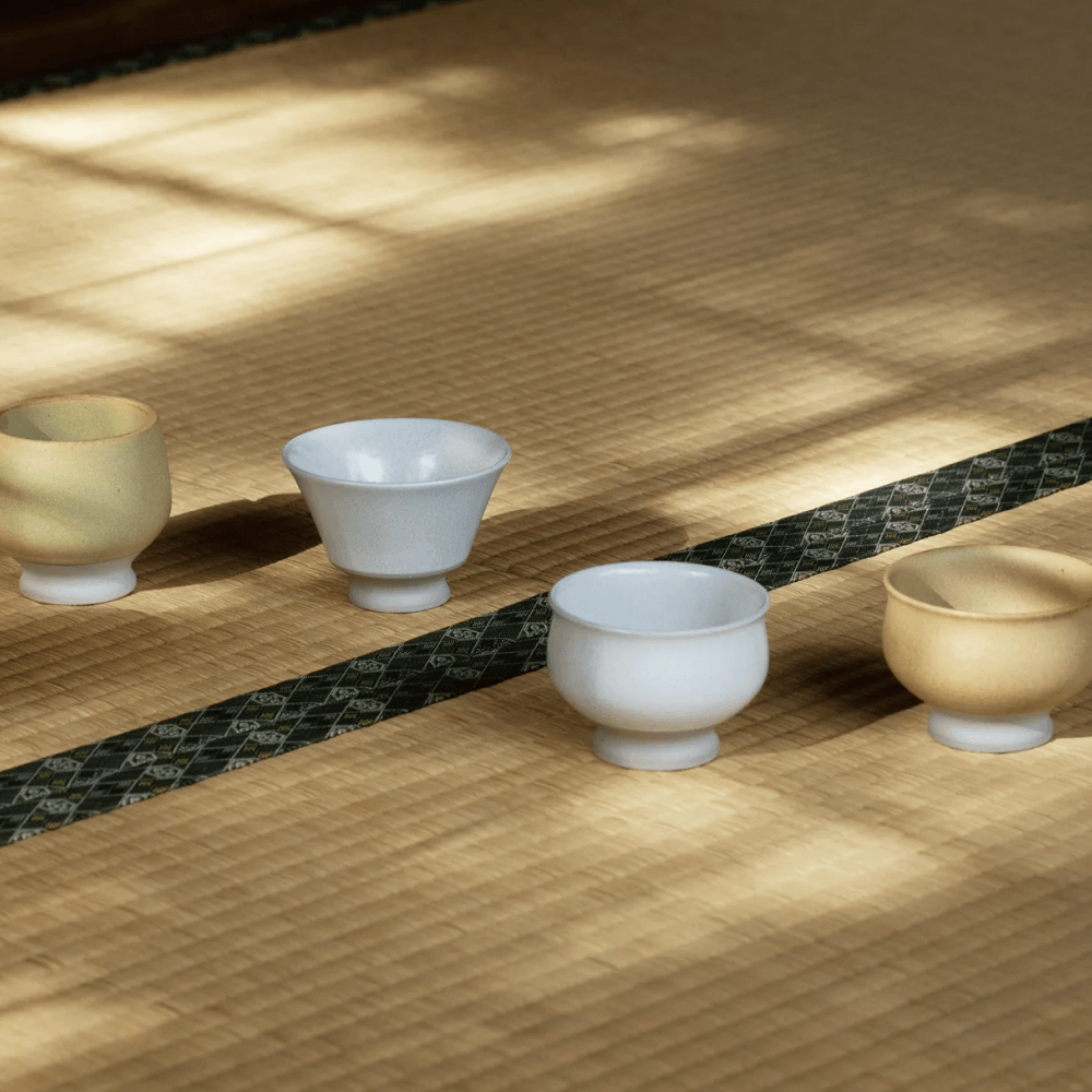 Japanese tea tools and accessories including cups bowls and traditional setup